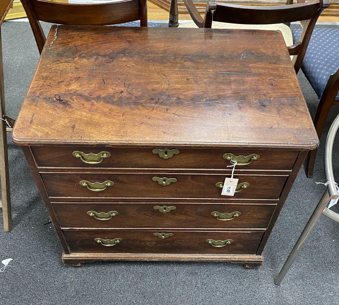 A small George II mahogany chest of drawers of four long drawers, with original brass batwing shaped brass escutcheons and handle back plates, heigth 75cm, width 74.5cm, depth 50cm